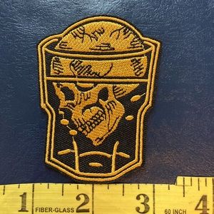 Black and gold skull patch